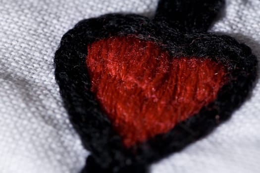 The heart embroidery pattern on the white cloth