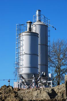 concrete factory - two tower tank outdoor on site