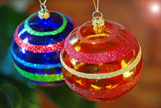 two blue and orange christmas balls decorations closeup