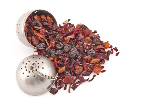 tea filter full of red tisane leaves and dried fruit