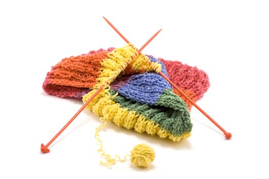 Knitted colour scarf, wool, spokes on white background