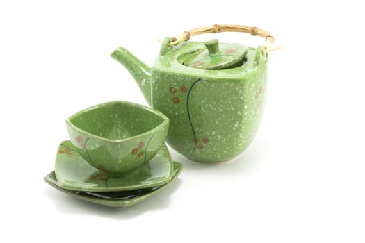 Chinese teapot with bamboo handle and cup insulated on white background