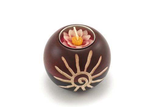 Candlesticks, wooden balls with candle on white background
