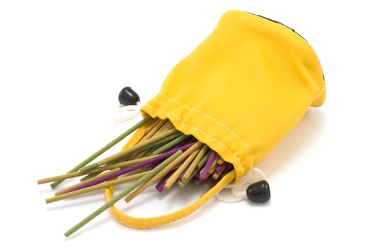 Yellow sac pervaded aromatic stick on white background