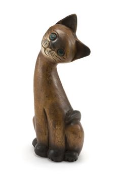 Wooden cat with green eye insulated on white background