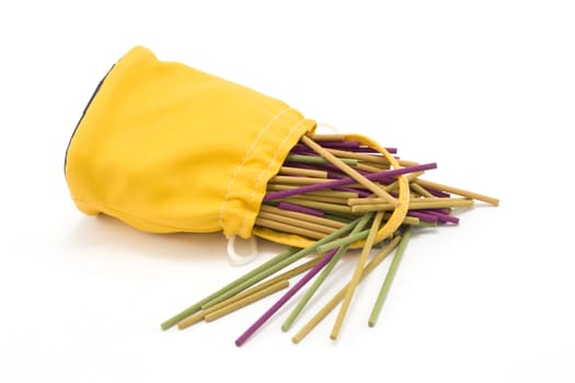Yellow sac pervaded aromatic stick on white background