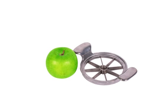 apple cutter and green apple isolated over white background