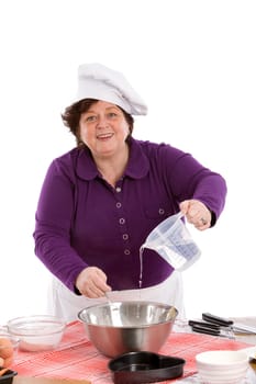 Happy chef adding some water into the mixing bowl