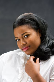 Portrait of a beautiful African-America woman in white shirt