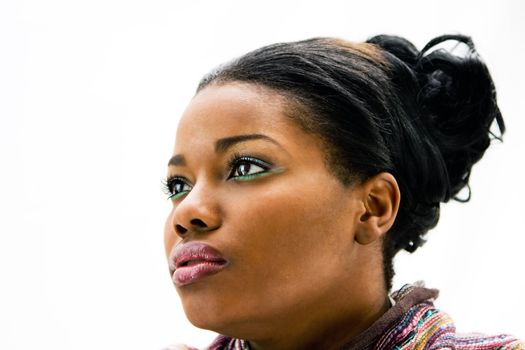 Face of a beautiful African American woman with colorful scarf, isolated