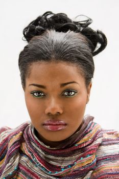 Face of a beautiful African American woman with colorful scarf, isolated