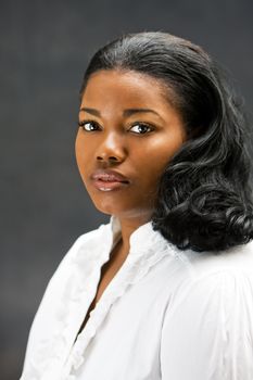 Portrait of a beautiful African-America woman in white shirt, isolated