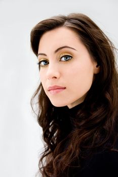 Face of a beautiful blue eyed brunette, isolated