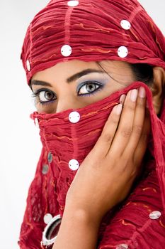 Beautiful woman with red head scarf, isolated