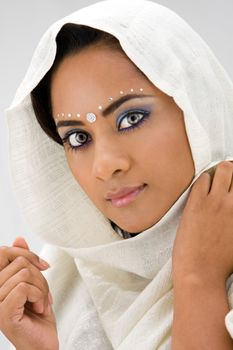 Beautiful woman with white head scarf, isolated