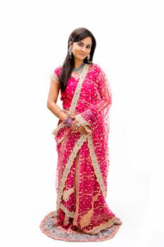 Beautiful Bangali bride in colorful dress standing, isolated