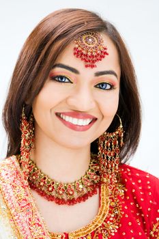 Beautiful Bangali bride in colorful dress, isolated