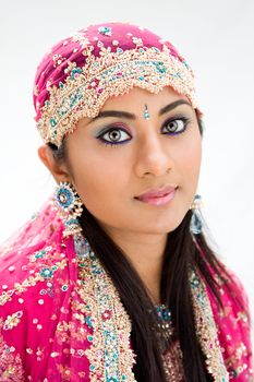 Beautiful Bengali bride in colorful dress, isolated