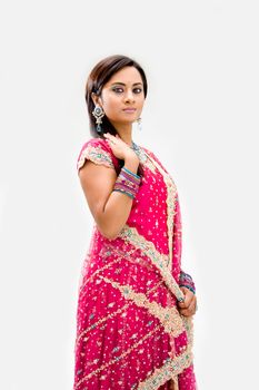 Beautiful Bengali bride in colorful dress, isolated