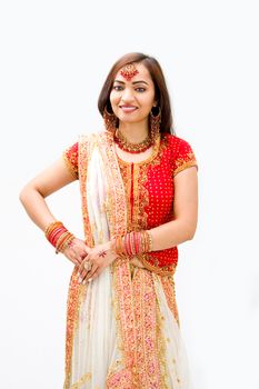 Beautiful Bengali bride in colorful dress, isolated