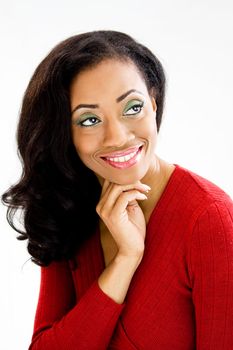 Face of beautiful African woman with hand under chin and smiling