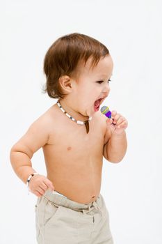 Cute topless toddler boy with necklace open mouth singing, isolated