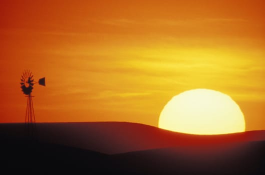 Windmill in front of setting sun