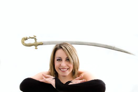 Face of a beautiful blonde balancing sword, isolated