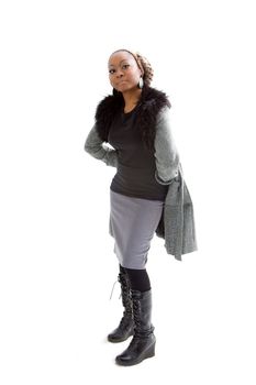 Beautiful African woman wearing gray winter wear, isolated