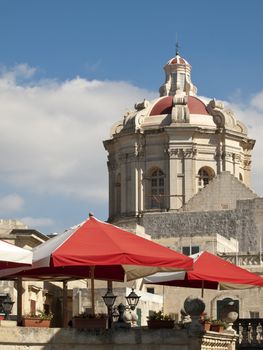 The dome of the cathedral in Mdina in Malta overlooking other buildings