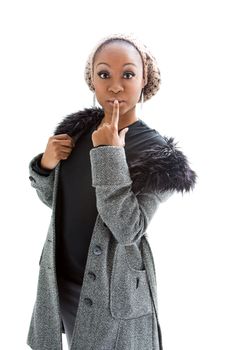 Beautiful African woman wearing gray winter wear, isolated