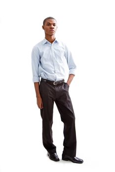 Young African business man standing relaxed and secure with hands in pocket, isolated
