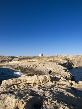 The Dwejra Tower at Dwejra in Gozo was built in 1651 to guard the medicinal plant on Fungus Rock.  The rock is too steep to climb so a sort of hoist resembling a funicular was built to ease the collection of this plant.