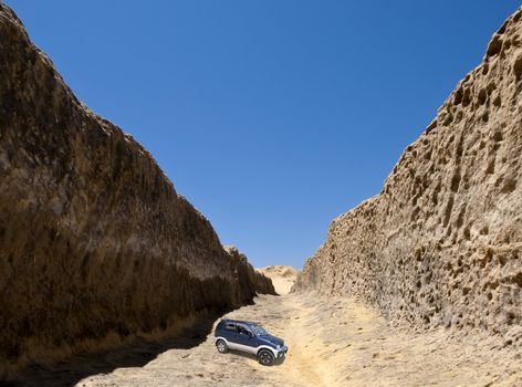 An SUV inside an ancient man-made valley