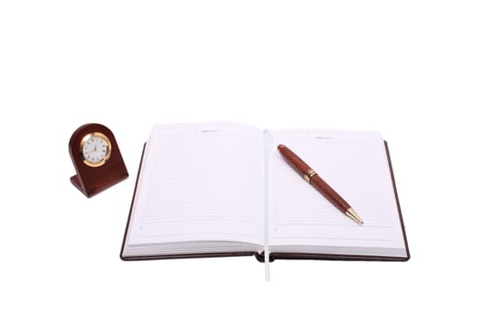brown notebook pen and clock isolated over white