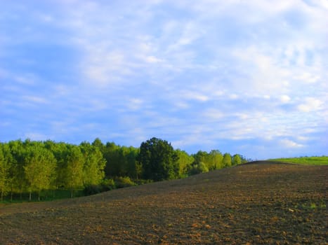 Landscape of hills, with clouds and trees