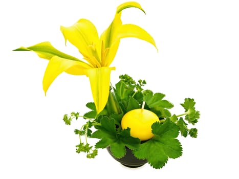 green bouquet with yellow lily and candle over white background