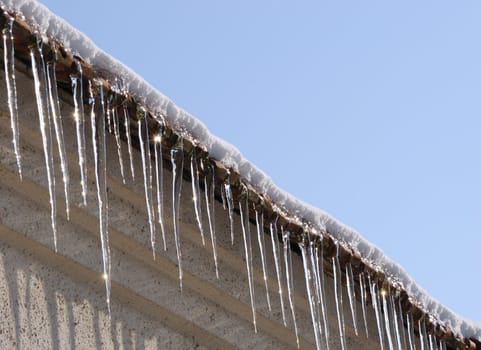 An icicle sparkles on a sunny day