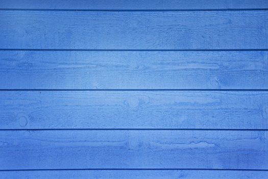 A blue wooden wall with horizontal planks