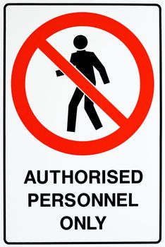 A white, red, and black authorized personnel only sign