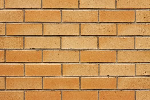 Closeup image of an orange brickwall