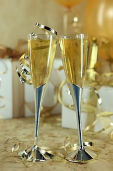 Two Champagne Flutes Leaning Towards One Another Symbolizing Love