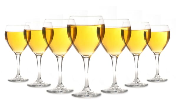 Glasses of Golden Alcohol Lined up on White Background