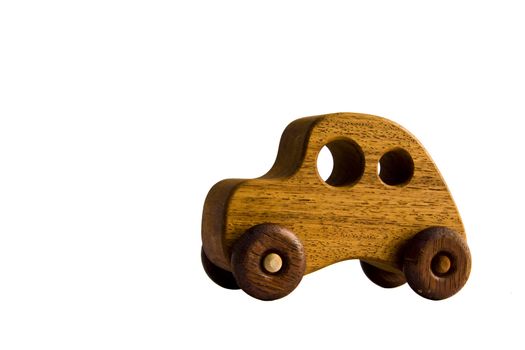 A funky wooden retro toy car over white with clipping path