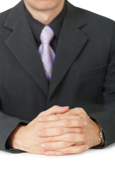 Hands of businessman close up lying on the table