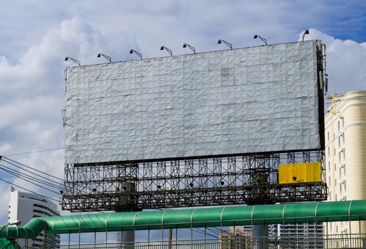 huge blank billboard in the middle of a city