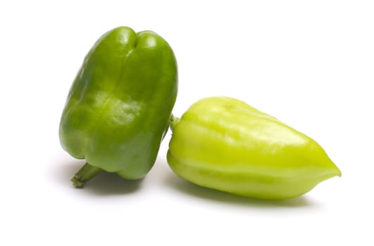 Two green pepper it is isolated on a white background.