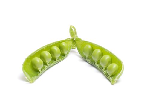 Open pod of peas it is isolated on a white background.