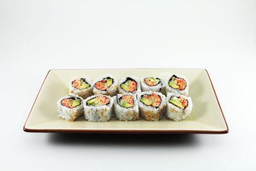 Close up of fresh sushi served on a oriental style plate.