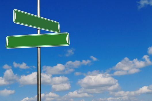 Blank Green Street Name Signs Against a Bright Blue Sky. Insert Your Own Text